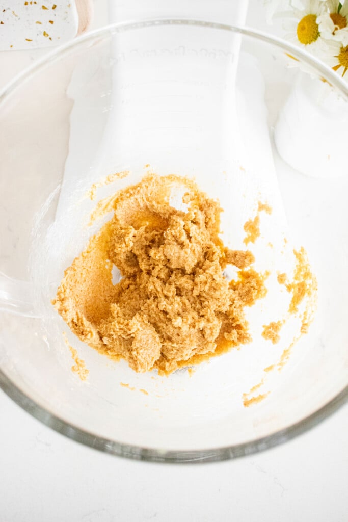 creamed butter and light brown sugar in a glass mixing bowl.