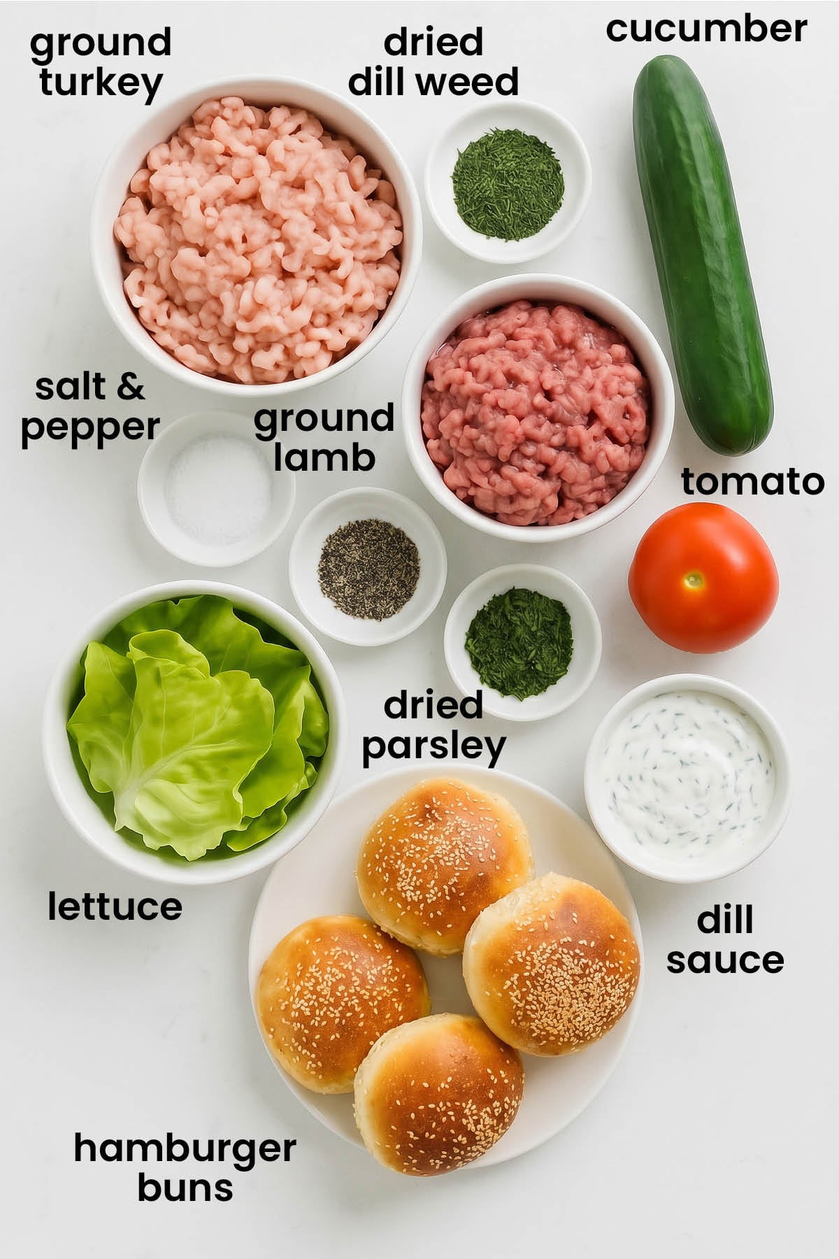 individual ingredients for turkey and lamb burgers with dill sauce laid out against a white background.