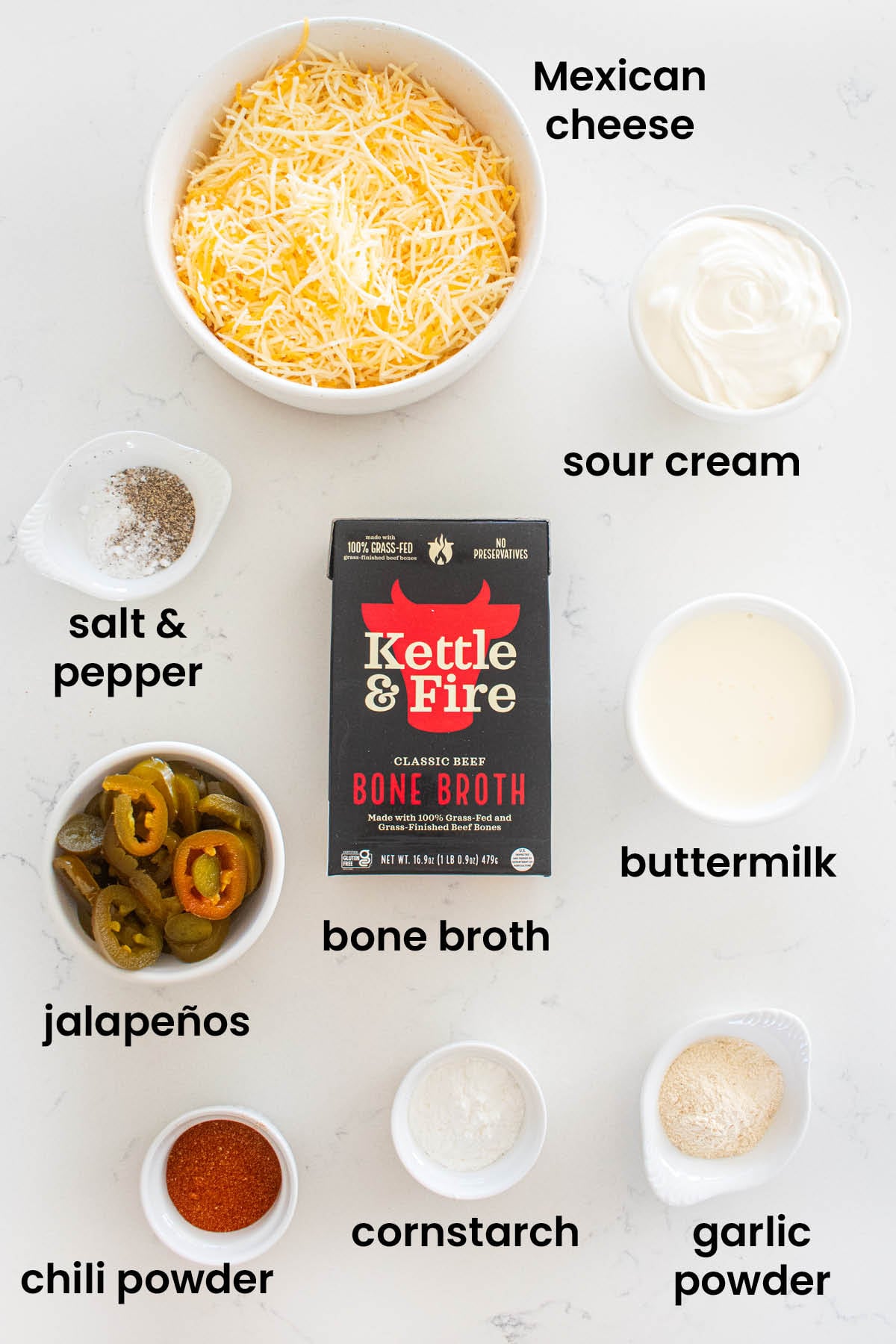 individual ingredients for bone broth queso dip laid out against a white background.