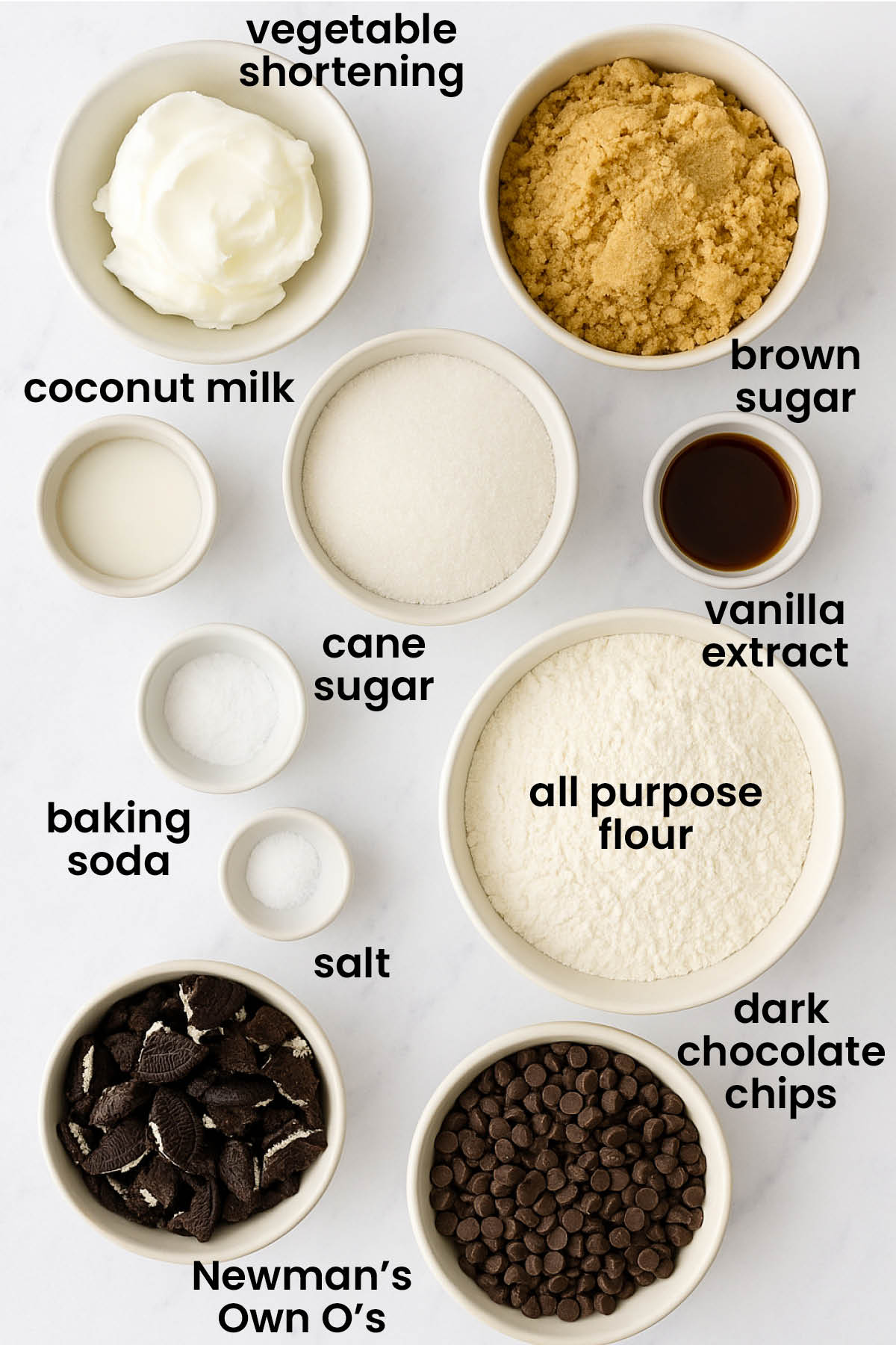 individual ingredients for vegan oreo chocolate chip cookies laid out against a white background.
