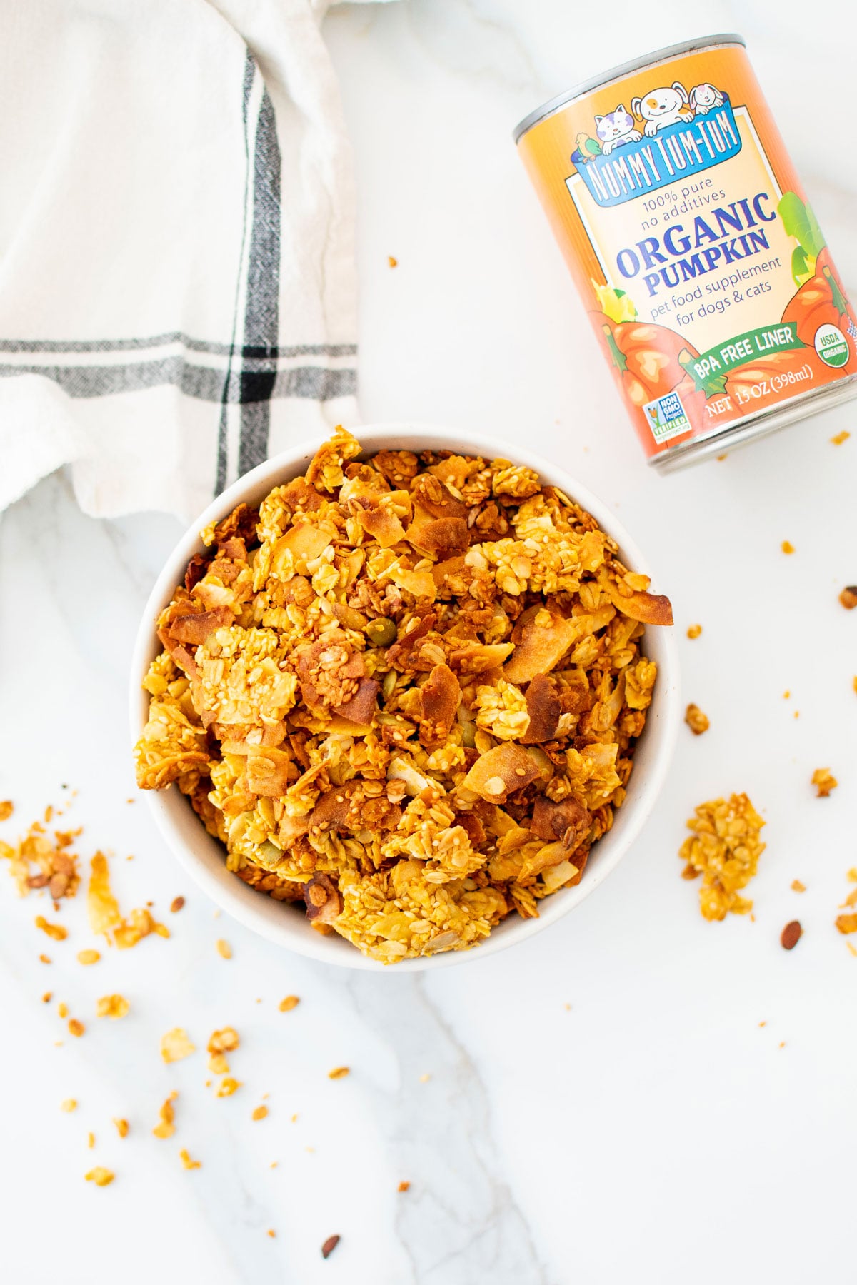 pumpkin granola for dogs in a bowl on the counter.