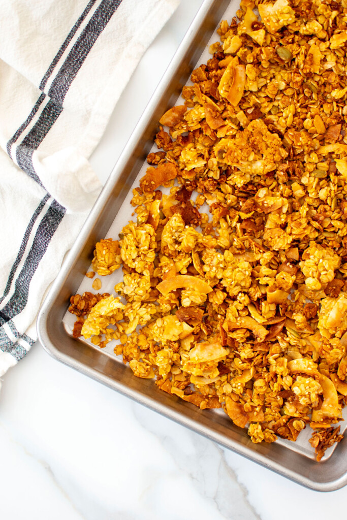 pumpkin granola for dogs on a baking sheet.