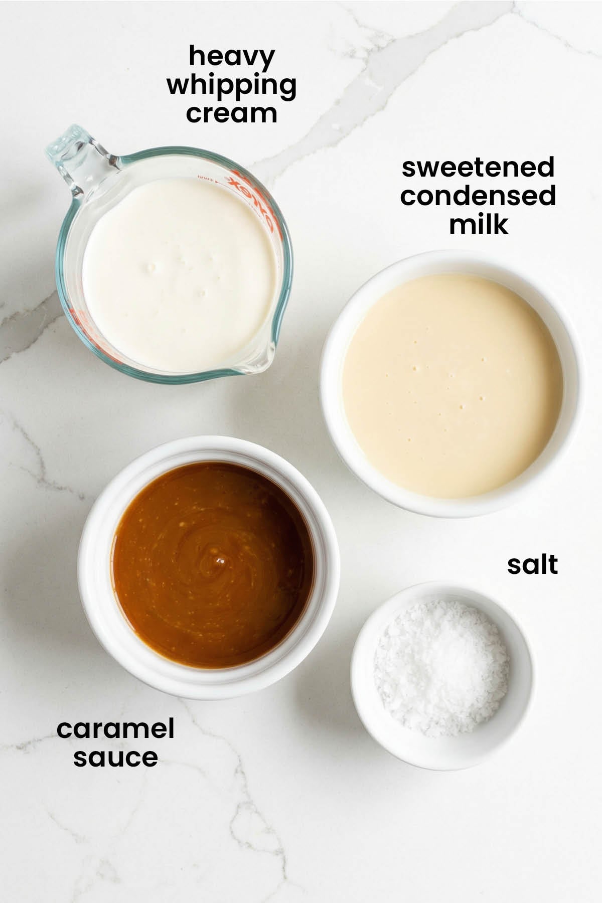individual ingredients for salted caramel no churn ice cream laid out against a white background.