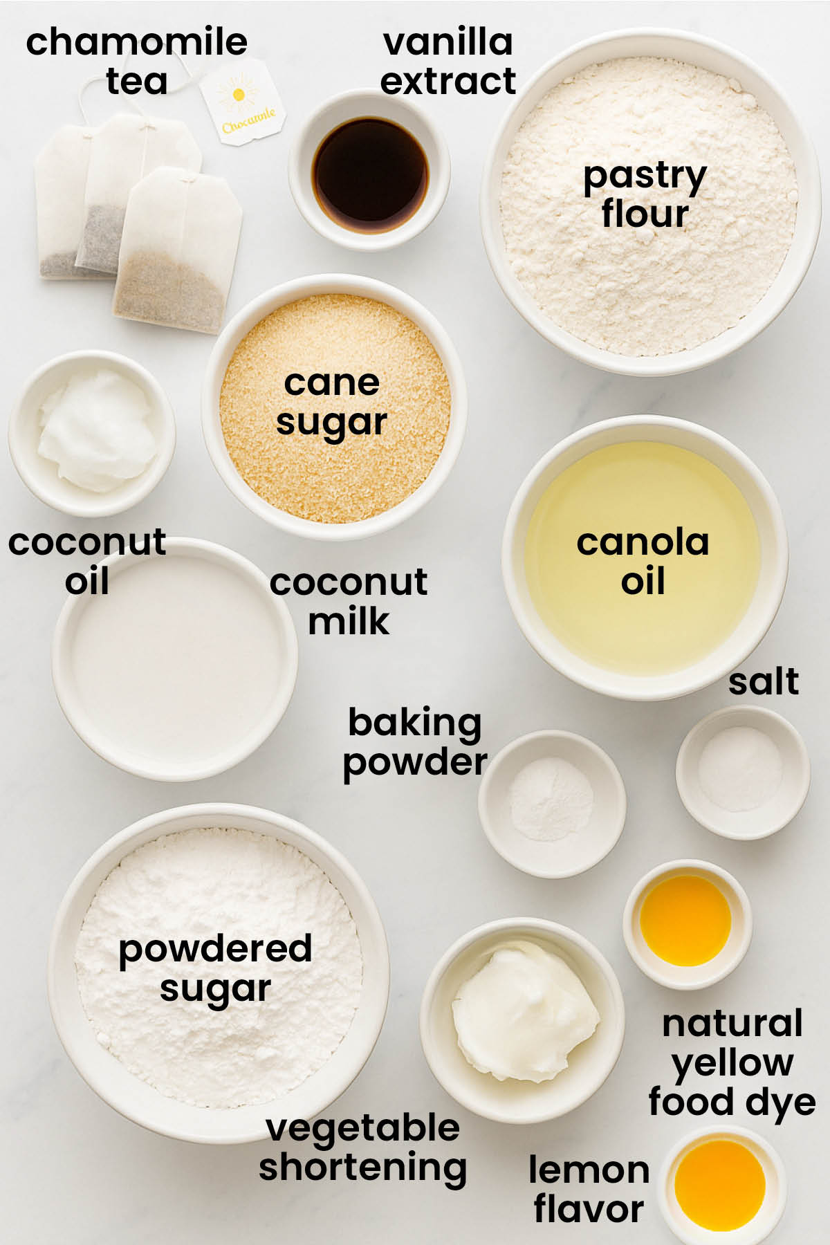 individual ingredients for vegan lemon chamomile tea cake laid out against a white background.