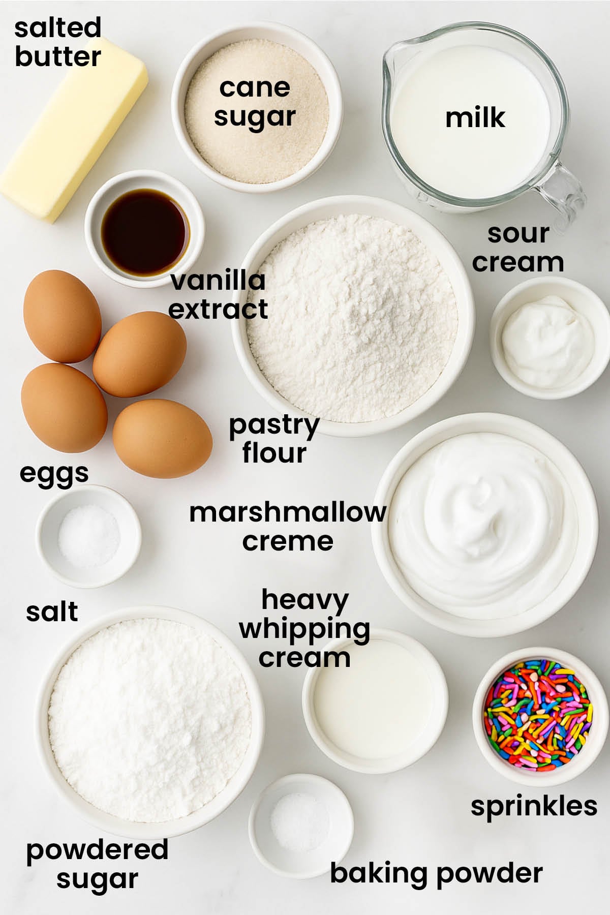 individual ingredients for birthday bundt cake laid out against a white background.