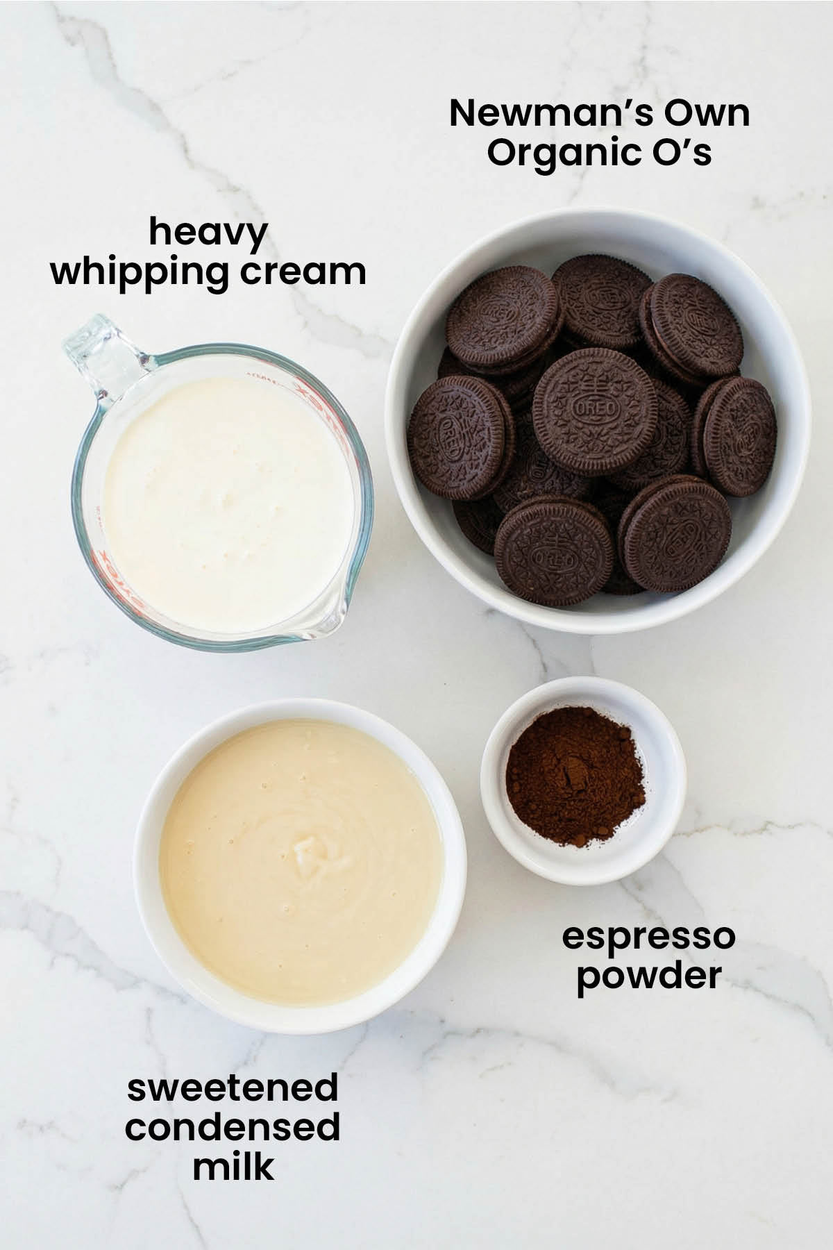 individual ingredients for cookies and cream coffee ice cream laid out against a white background.