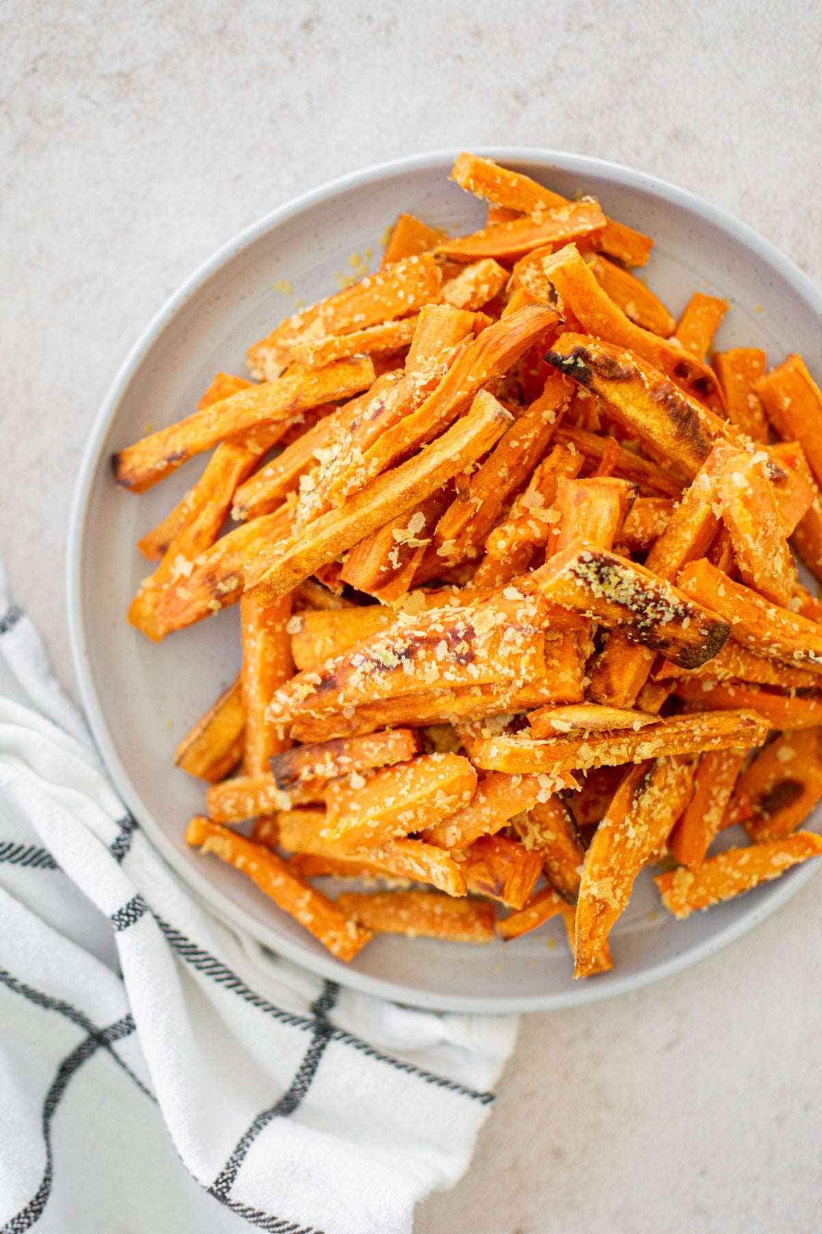 dog friendly sweet potato fries on a gray plate.