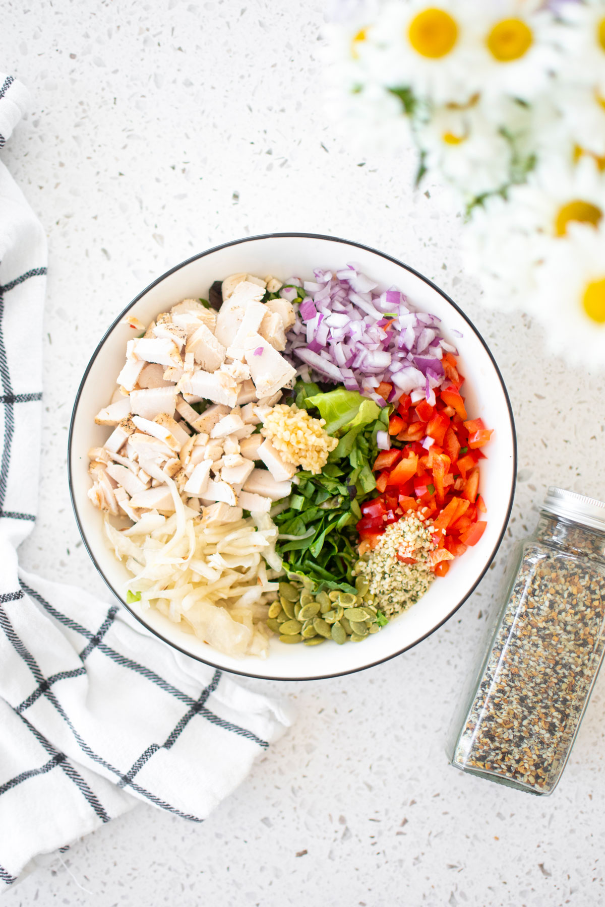 gut healthy chicken salad in a large bowl on a white countertop.
