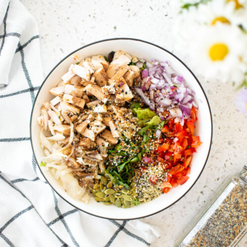 gut healthy chicken salad in a large bowl on a white countertop.