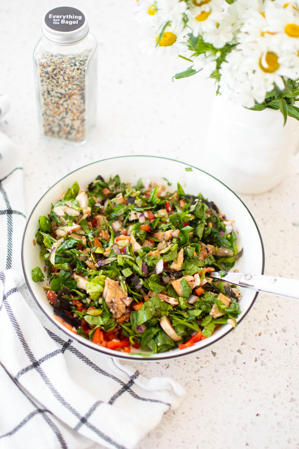 gut healthy chicken salad in a large bowl on a white countertop.