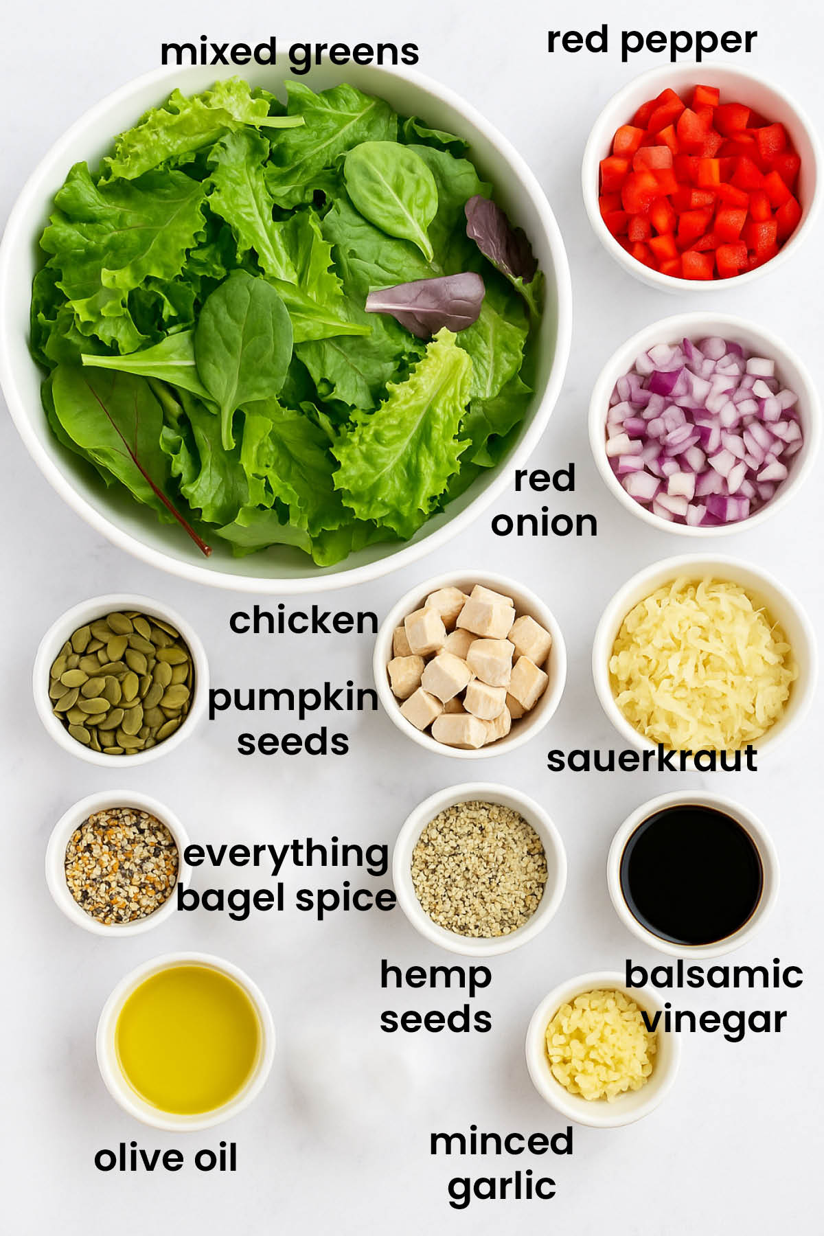 individual ingredients for gut healthy chicken salad laid out against a white background.