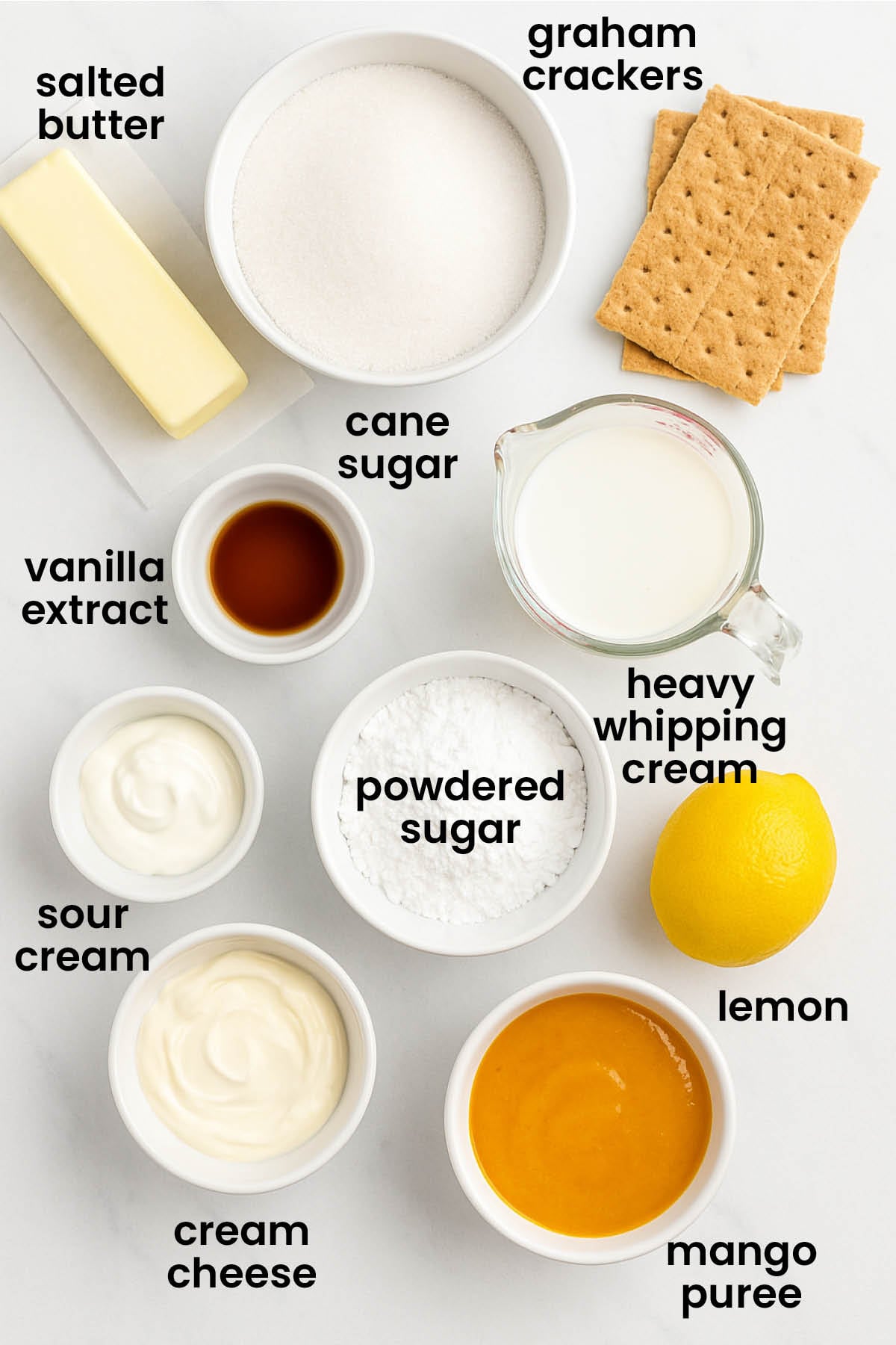 individual ingredients for easy mango cheesecake laid out against a white background.