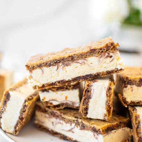 plate of sourdough chocolate chip ice cream sandwiches on a white marble counter.