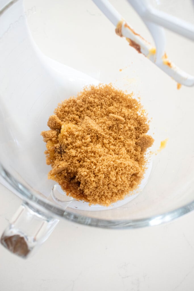 brown sugar and brown butter in a glass mixing bowl.
