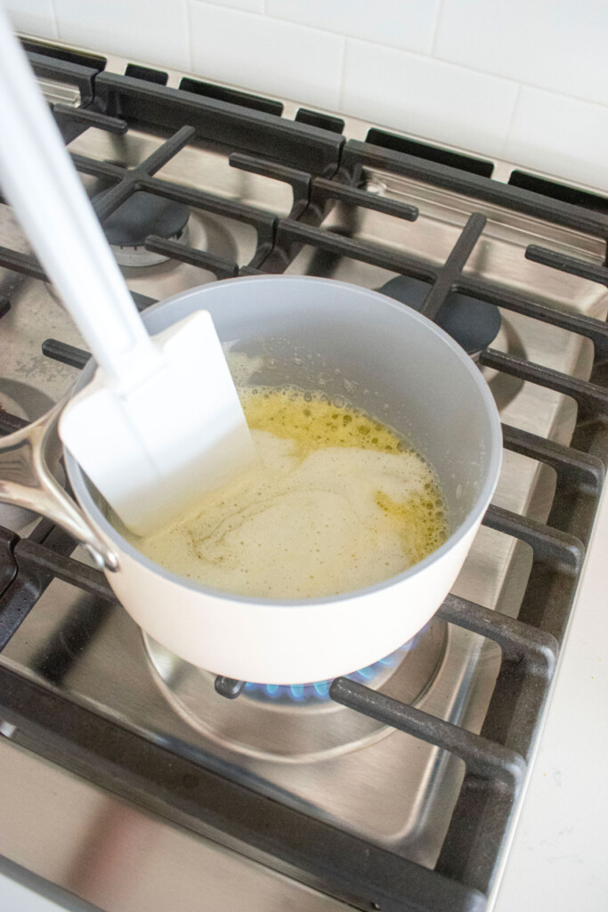 butter browning in a small pot on the stovetop.