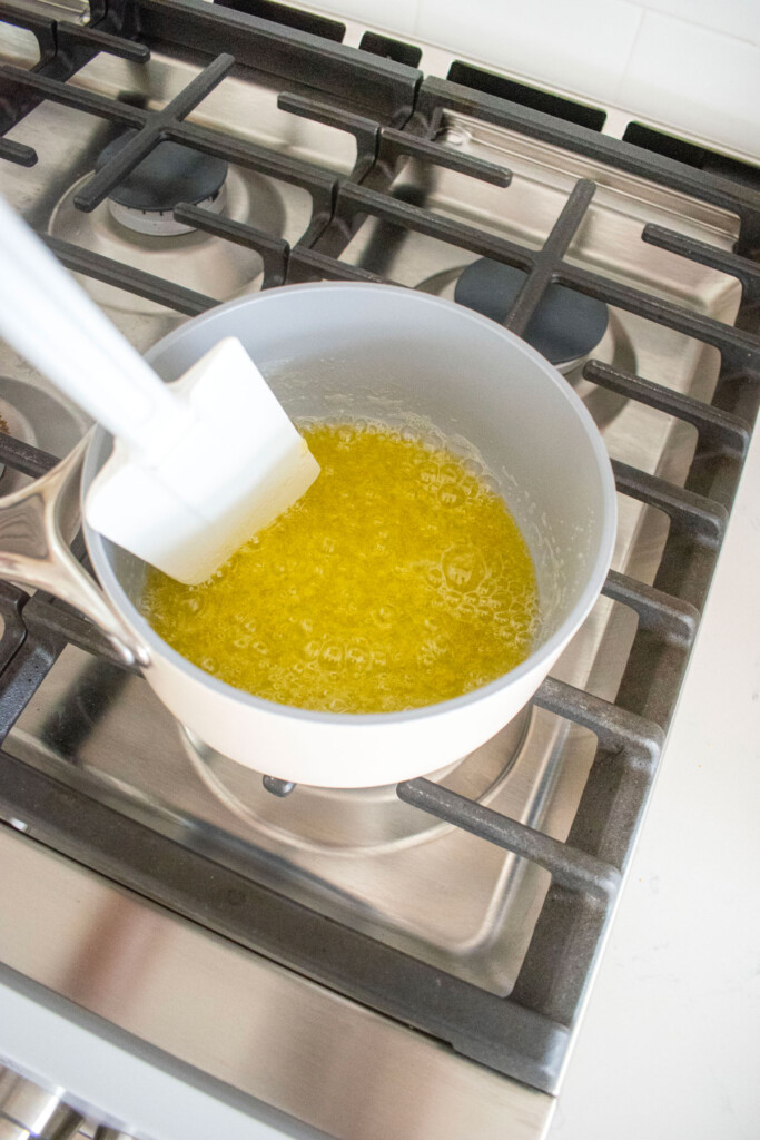 butter browning in a small pot on the stovetop.