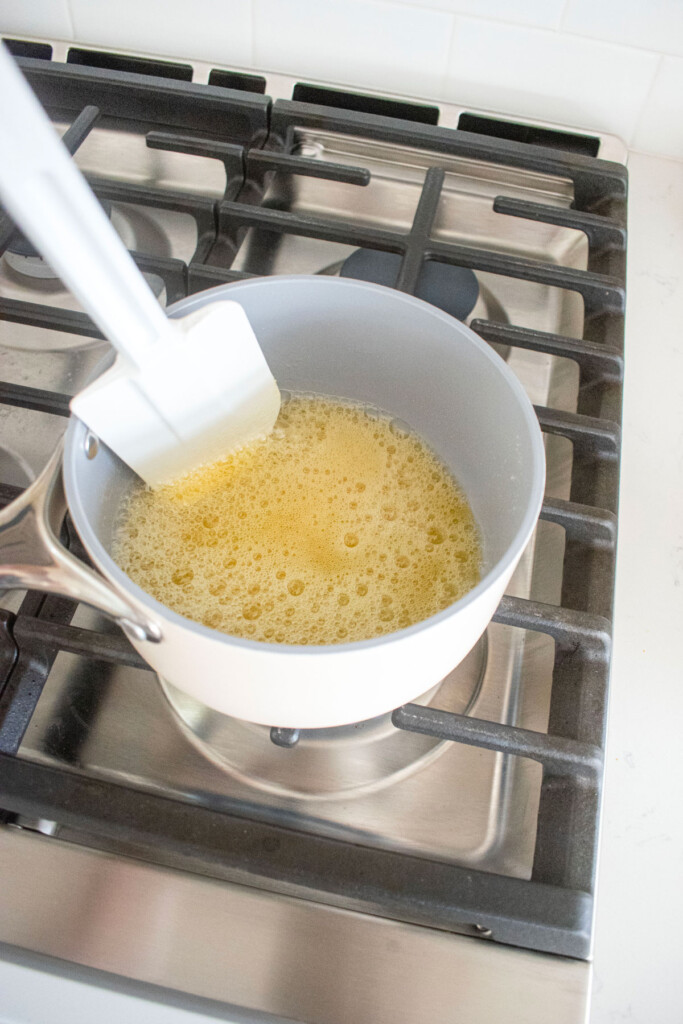 butter browning in a small pot on the stovetop.