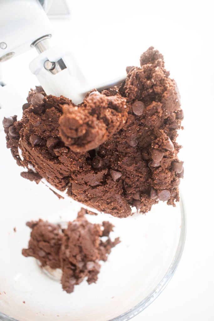 double chocolate pumpkin cookie dough in a glass mixing bowl.