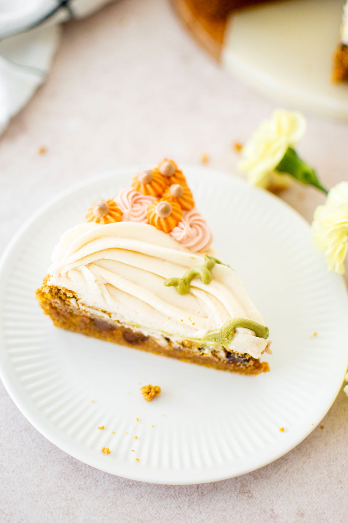 slice of pumpkin chocolate chip cookie cake on a white plate.
