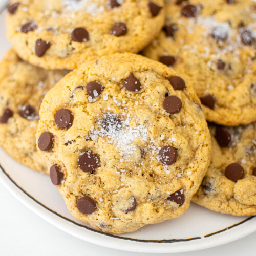 maple brown sugar cookies on a white plate on a white marble counter.