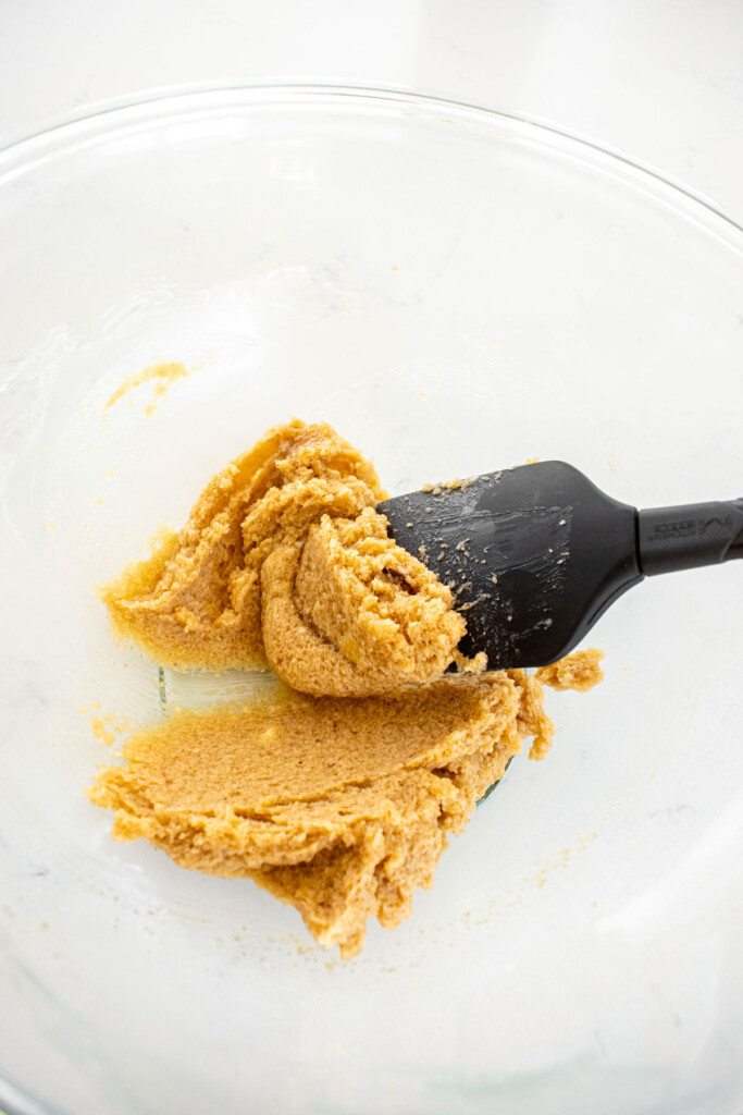 creamed brown sugar, maple syrup and butter in a glass mixing bowl.
