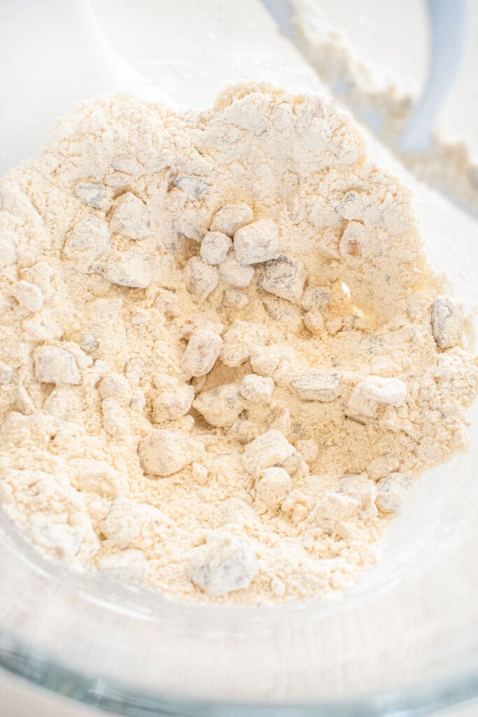 ingredients for brown butter pie crust in a glass mixing bowl.