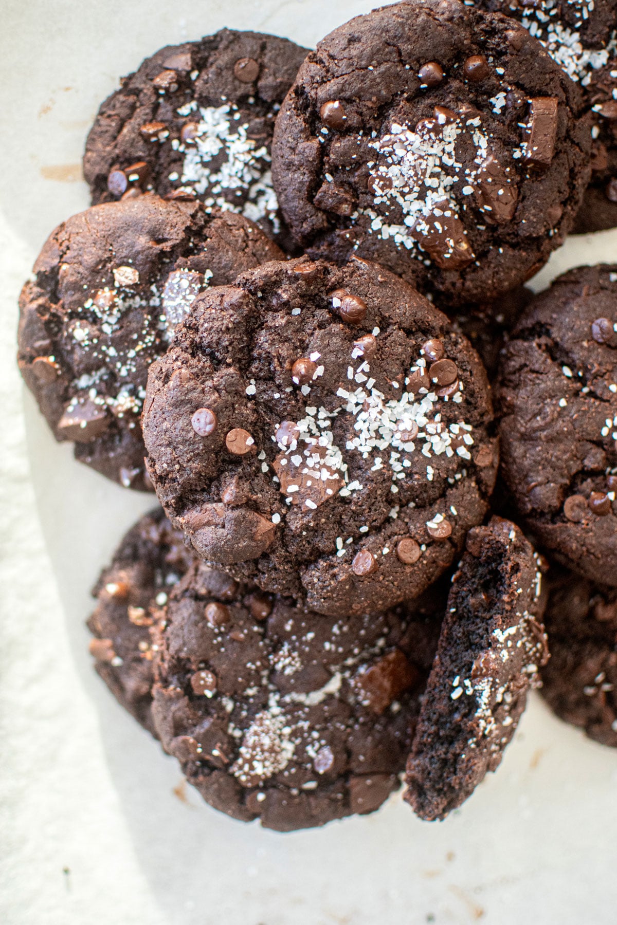chocolate peppermint crunch cookies with flaky sea salt on a baking sheet.