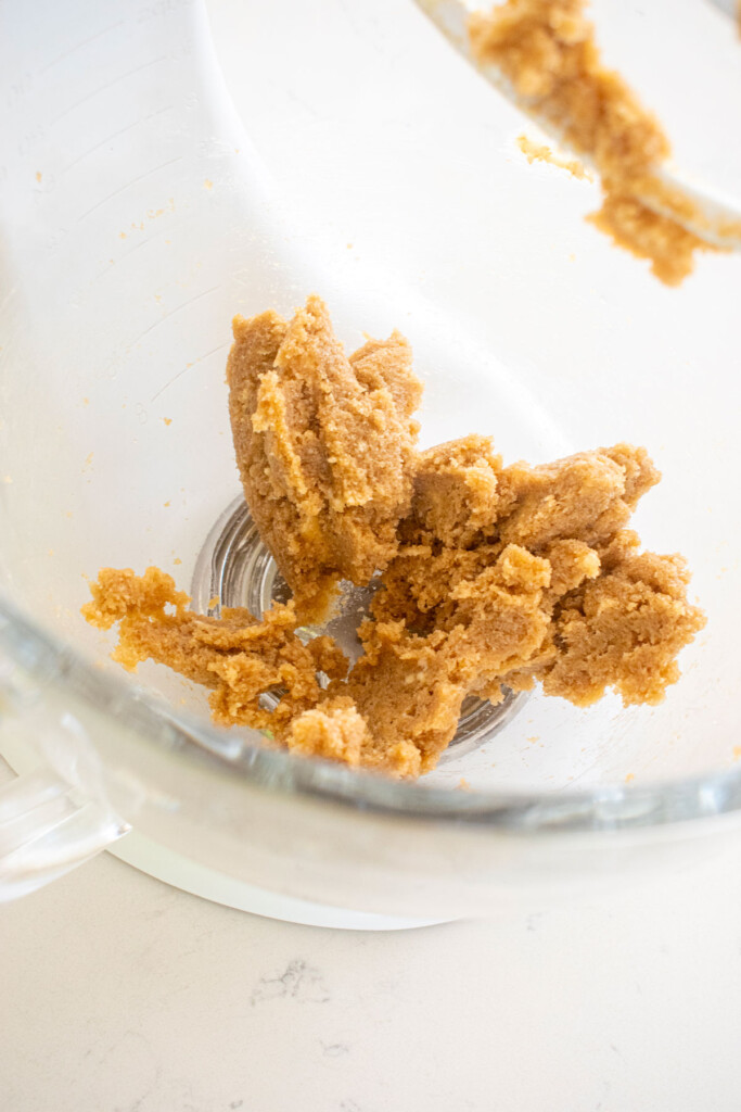 creamed butter and light brown sugar in a glass mixing bowl.