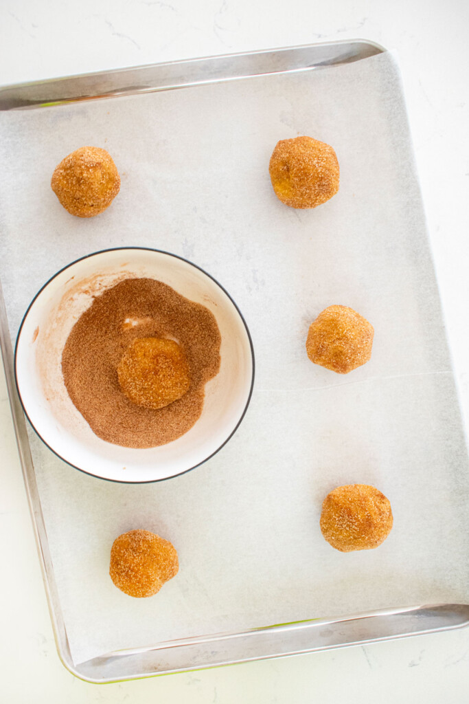 eggless brown sugar pumpkin snickerdoodle cookie dough on a baking sheet.