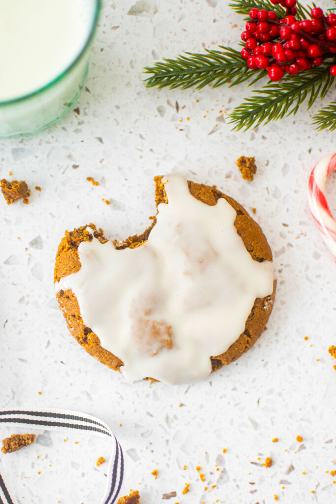 eggless pumpkin gingerbread cooke with a bite taken out on a marble counter.