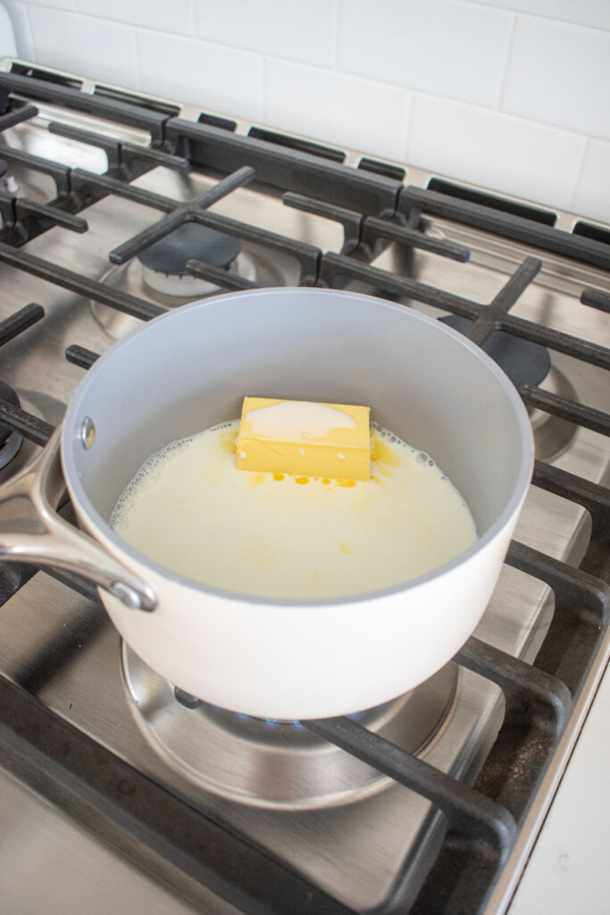 milk and butter in a small pot on the stovetop.