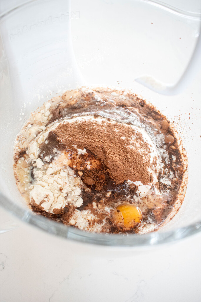 hot chocolate sweet roll dough ingredients in a glass mixing bowl.