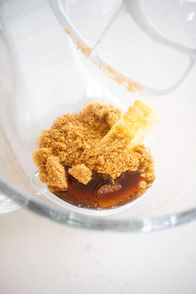 butter, brown sugar and maple syrup in a glass mixing bowl.
