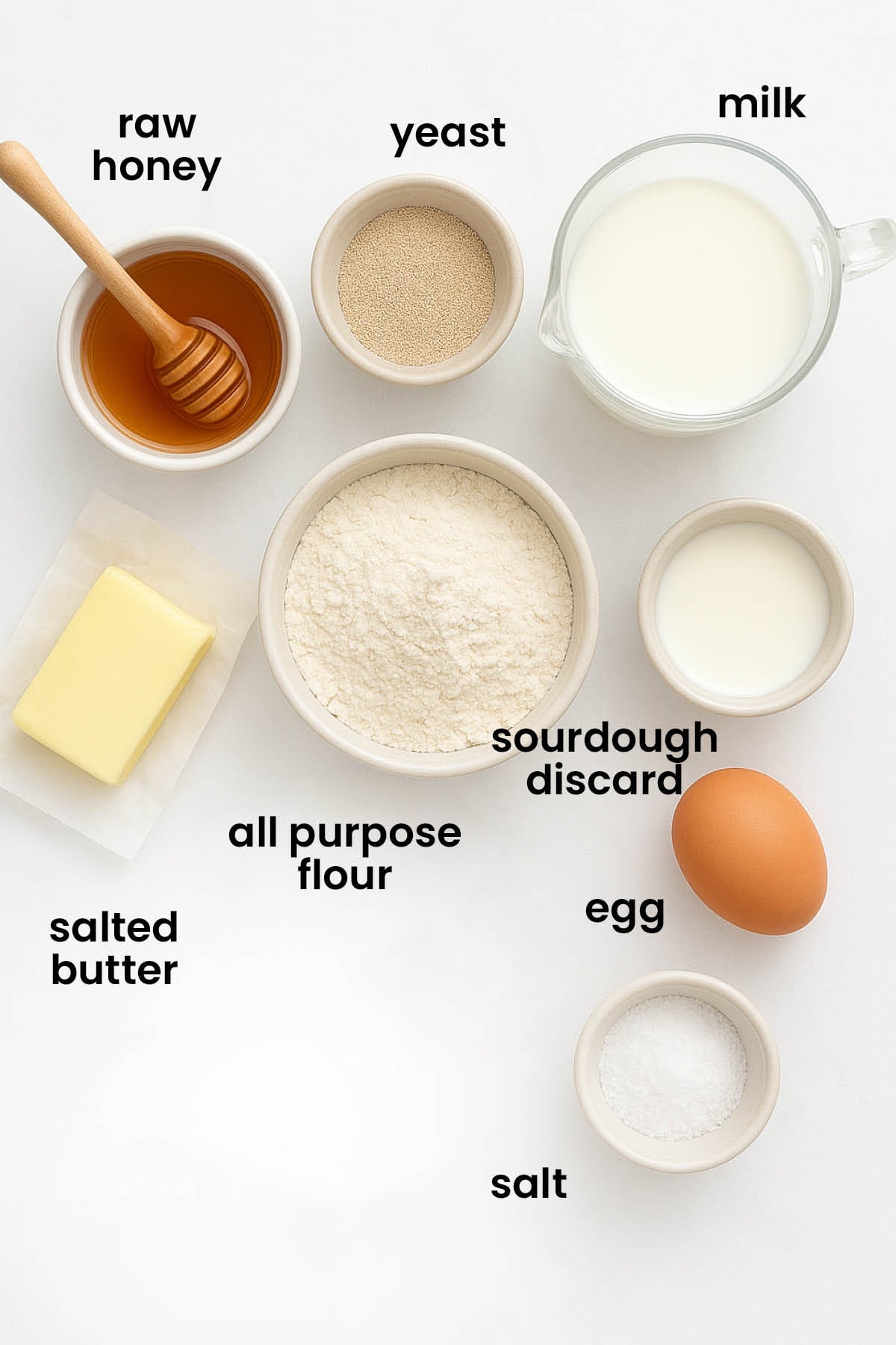 individual ingredients for sourdough crescent rolls laid out against a white background.