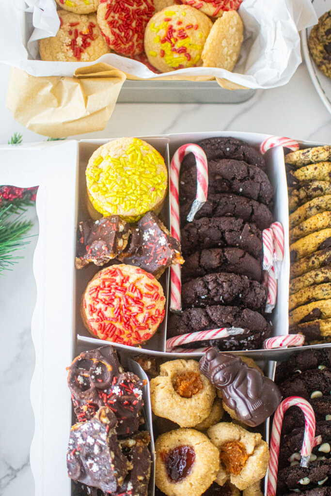 diy christmas cookie box with separators and different cookies in each slot.