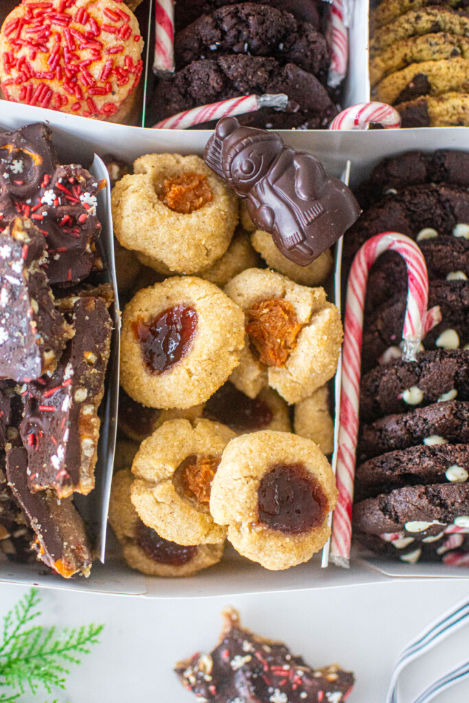 diy christmas cookie box with separators and different cookies in each slot.
