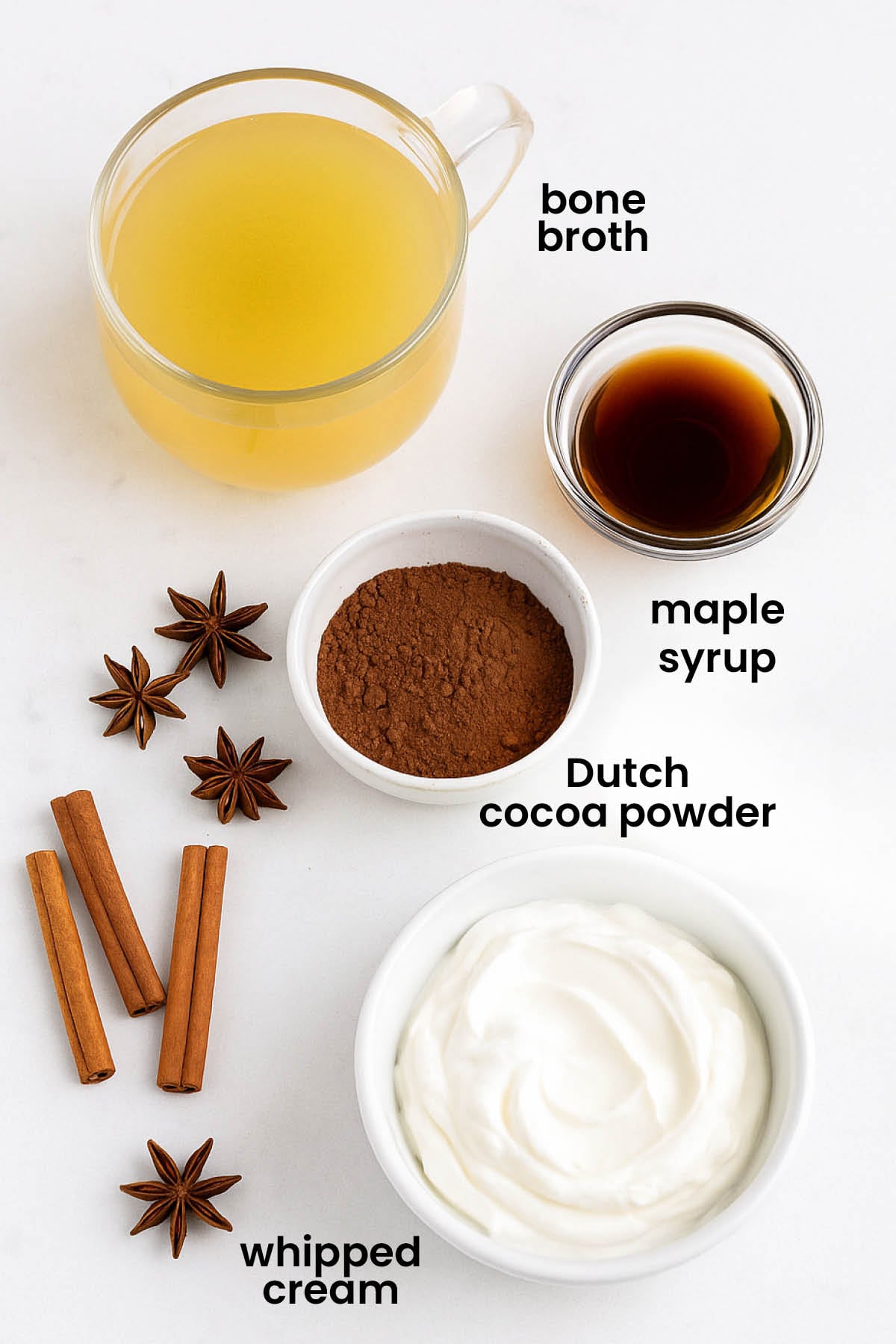 individual ingredients for healthy gingerbread hot cocoa laid out against a white background.
