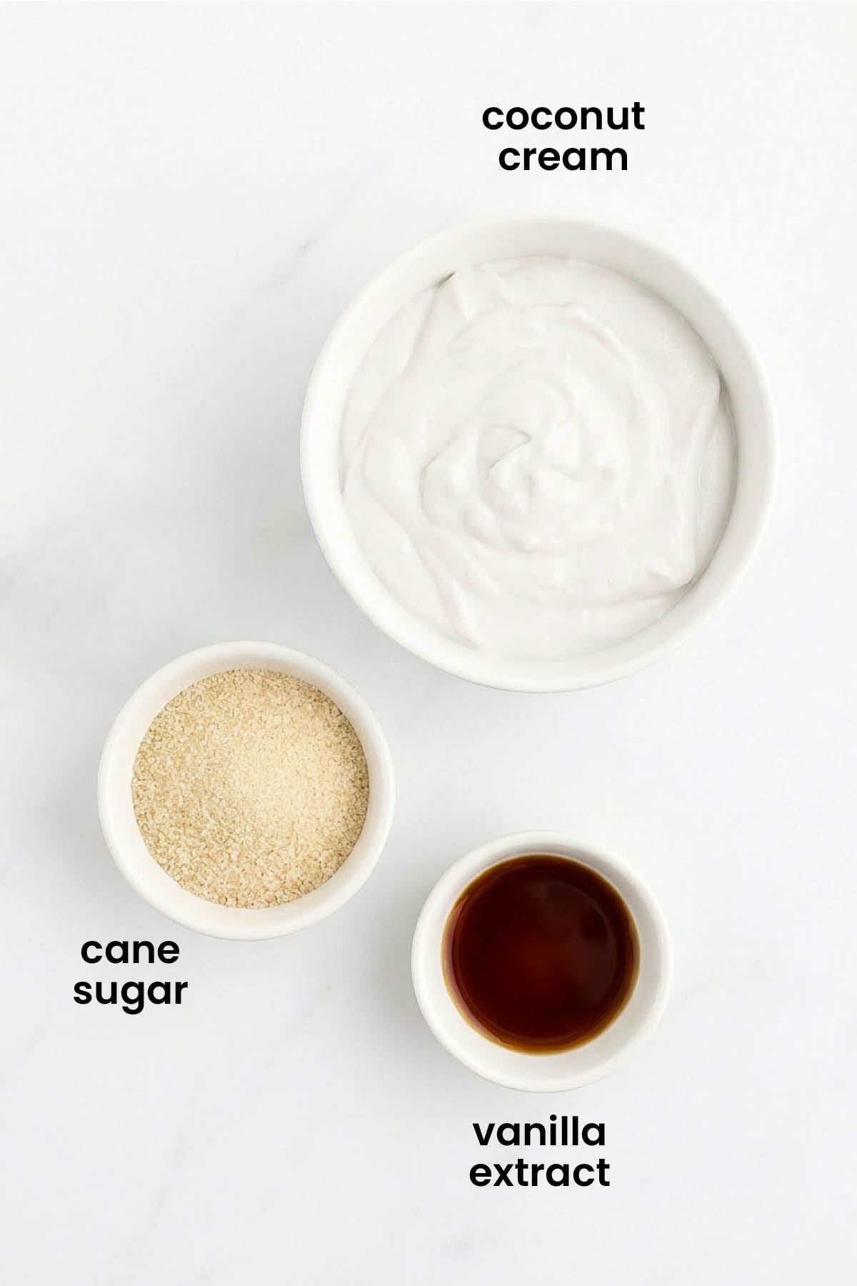 individual ingredients for homemade organic vegan whipped cream laid out against a white background.