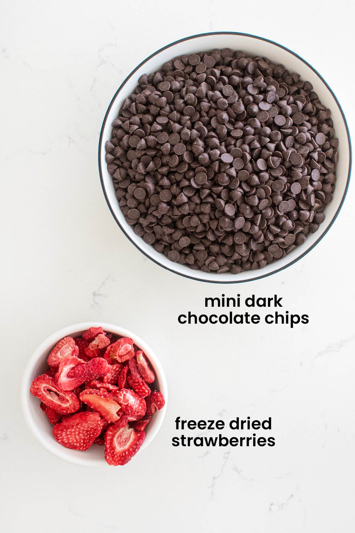 individual ingredients for strawberry chocolate bars laid out against a white background.