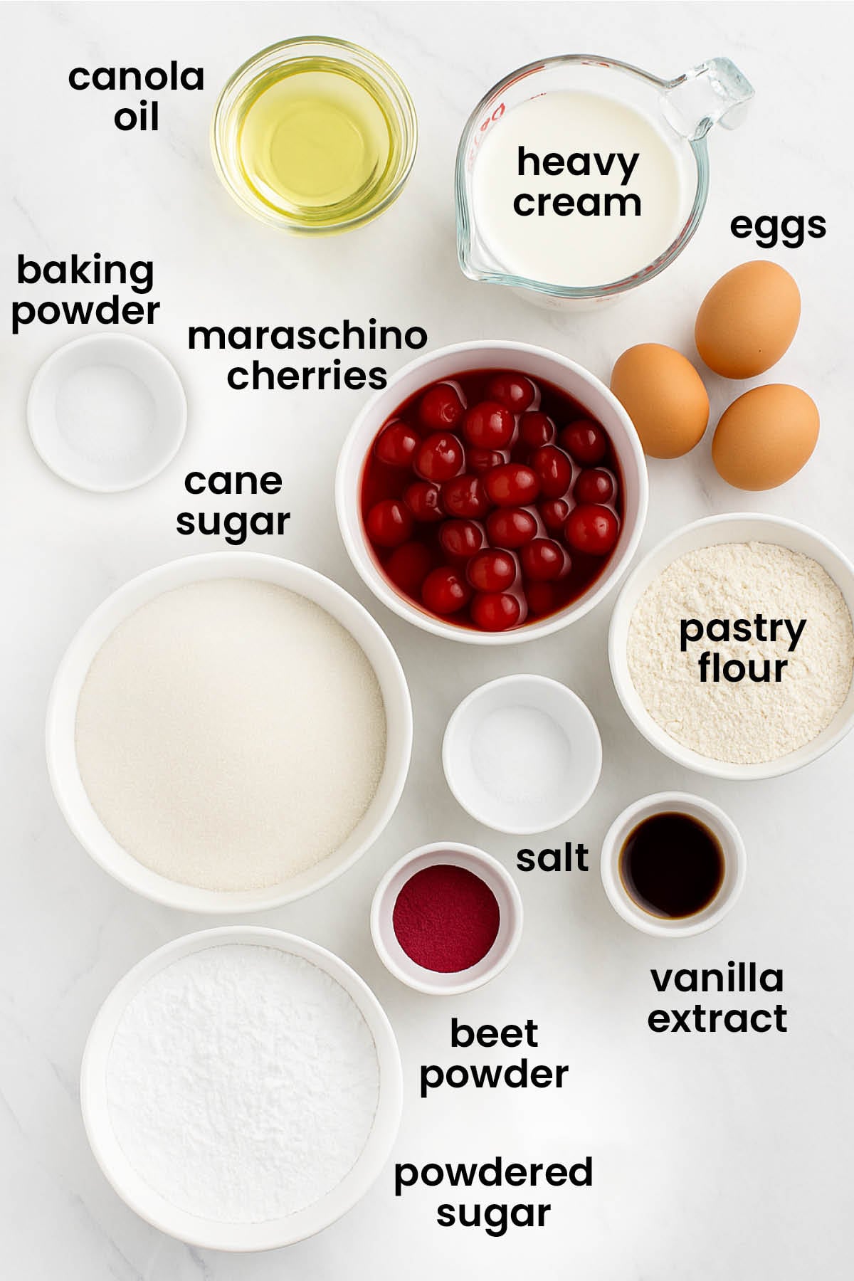 individual ingredients for cherry cake with whipped cream frosting laid out against a white background.