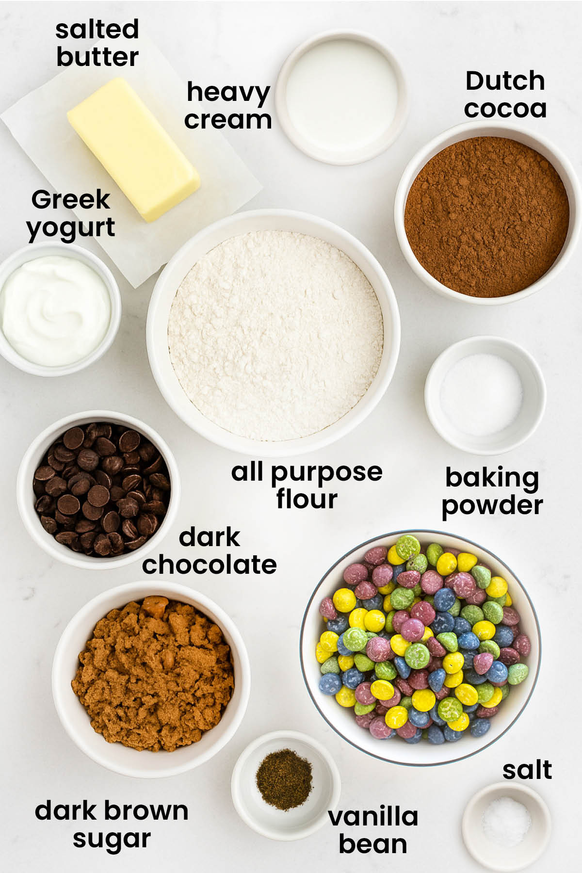 individual ingredients for eggless cosmic brownie cookies laid out against a white background.