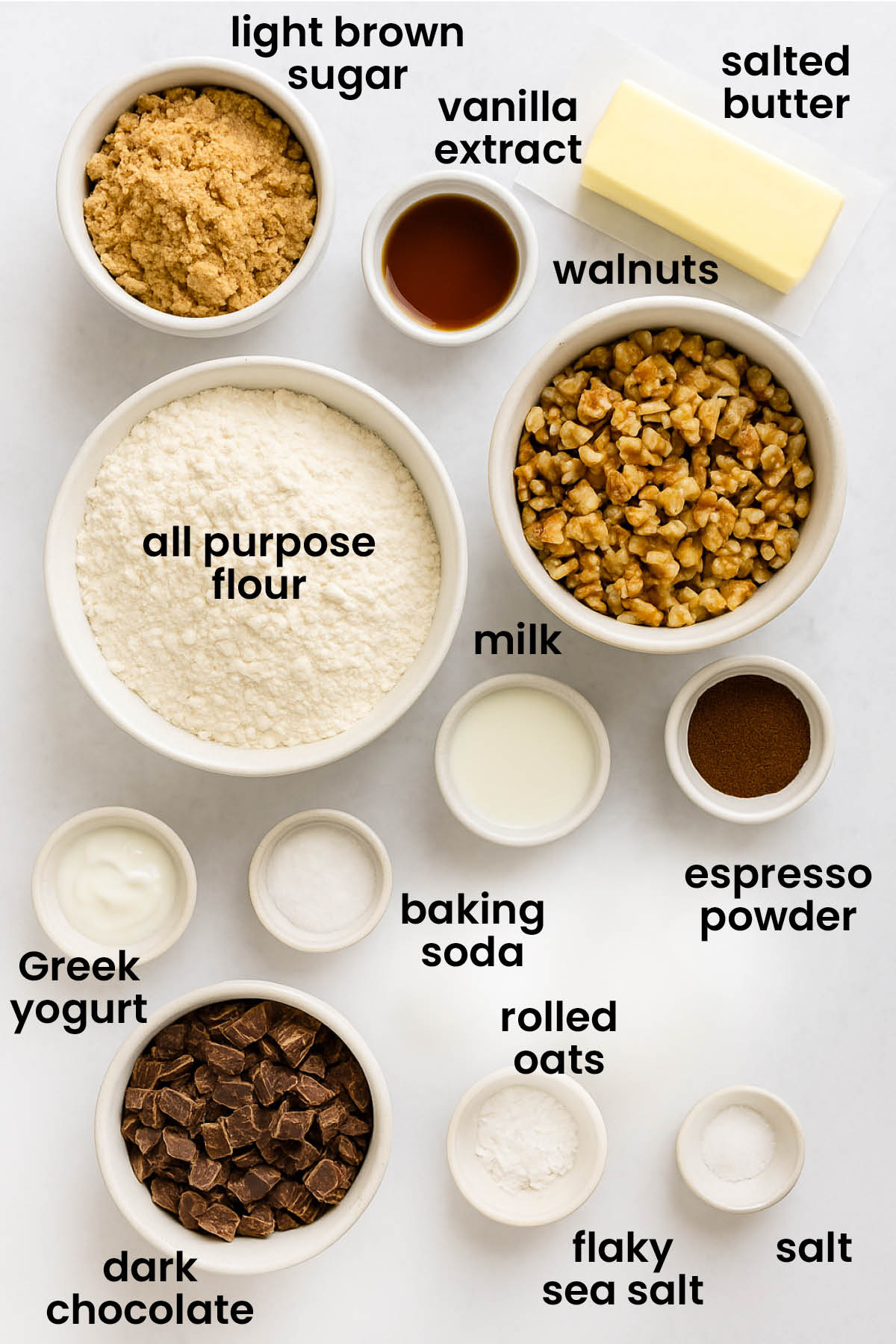 individual ingredients for espresso walnut chocolate chip cookies laid out against a white background.