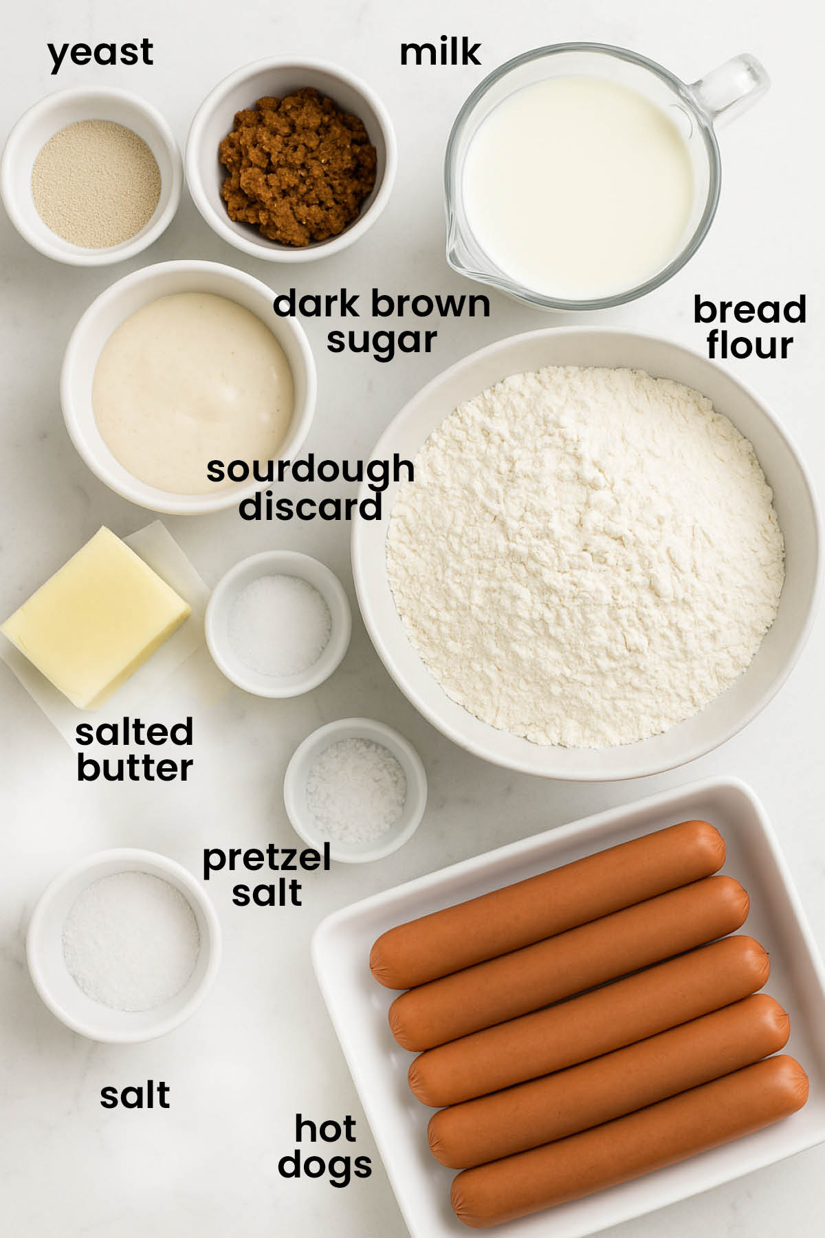 individual ingredients for sourdough pretzel hot dog buns laid out against a white background.