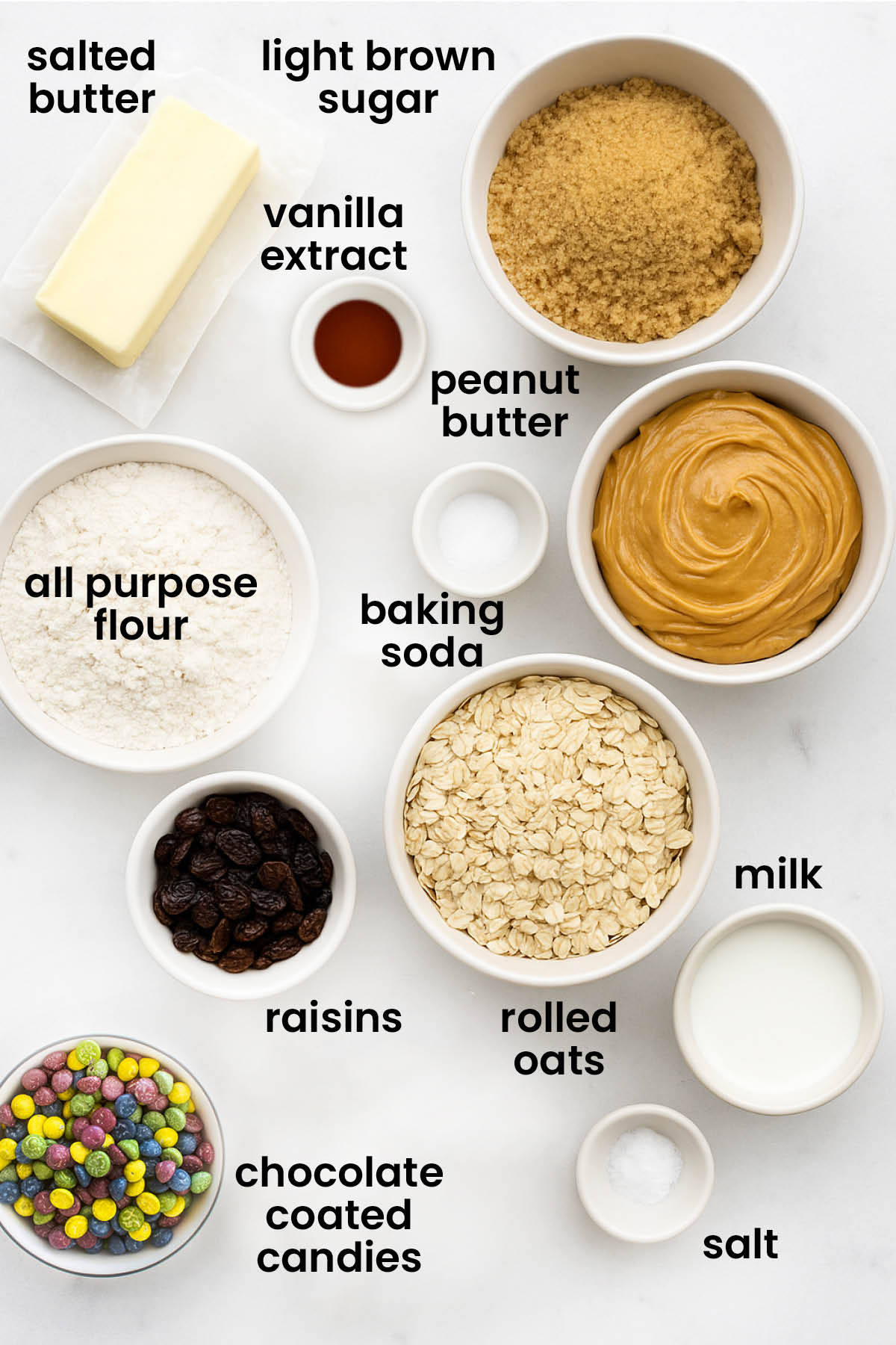 individual ingredients for eggless monster cookies laid out against a white background.