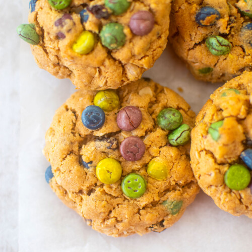 eggless monster cookies on a piece of parchment paper.