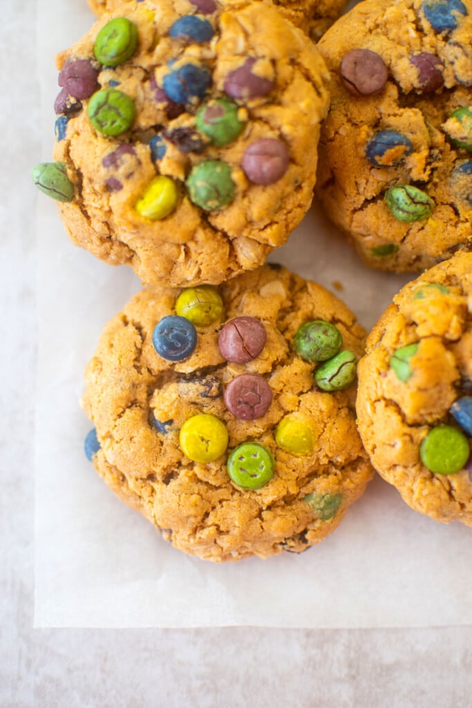 eggless monster cookies on a piece of parchment paper.