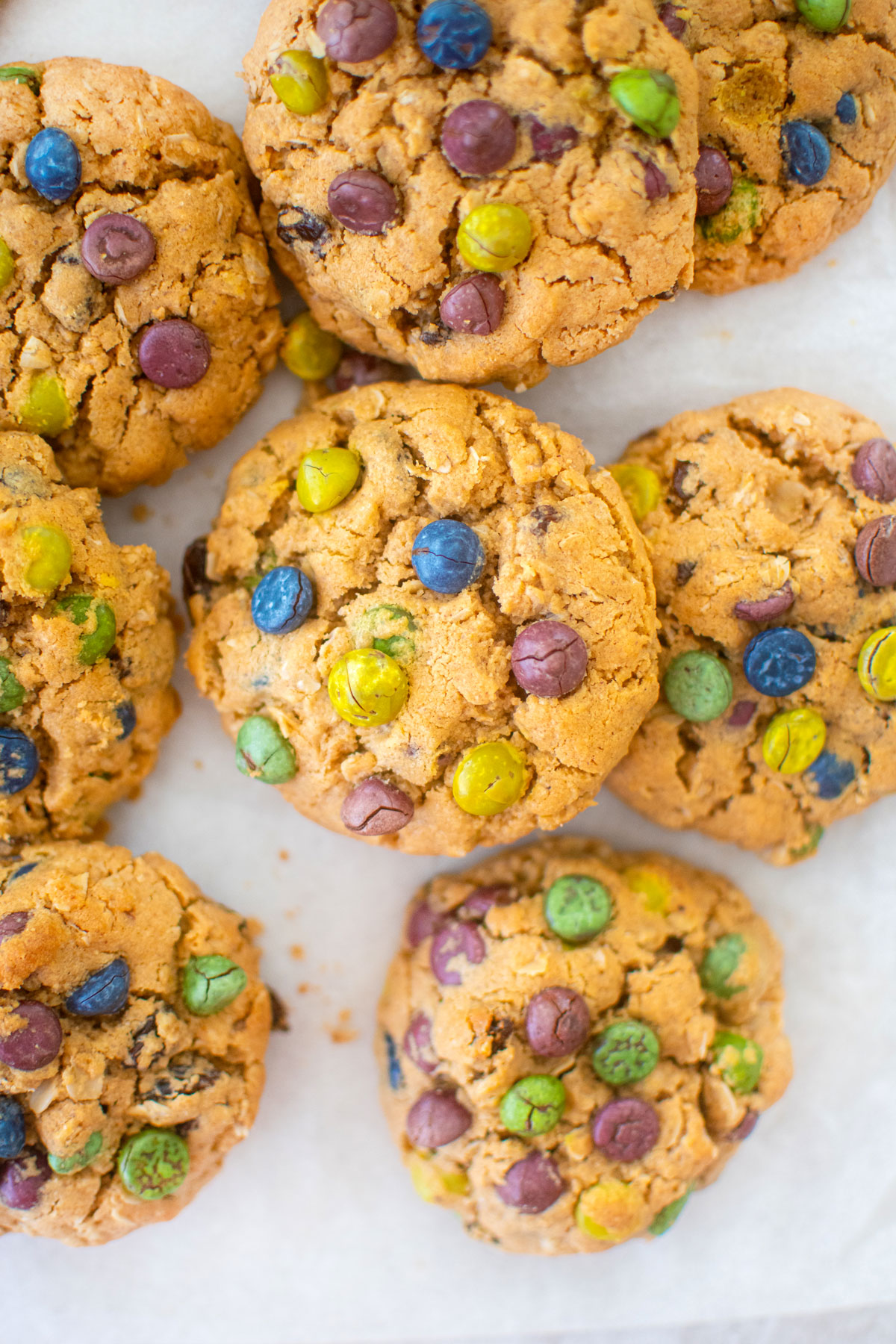 eggless monster cookies on a piece of parchment paper.