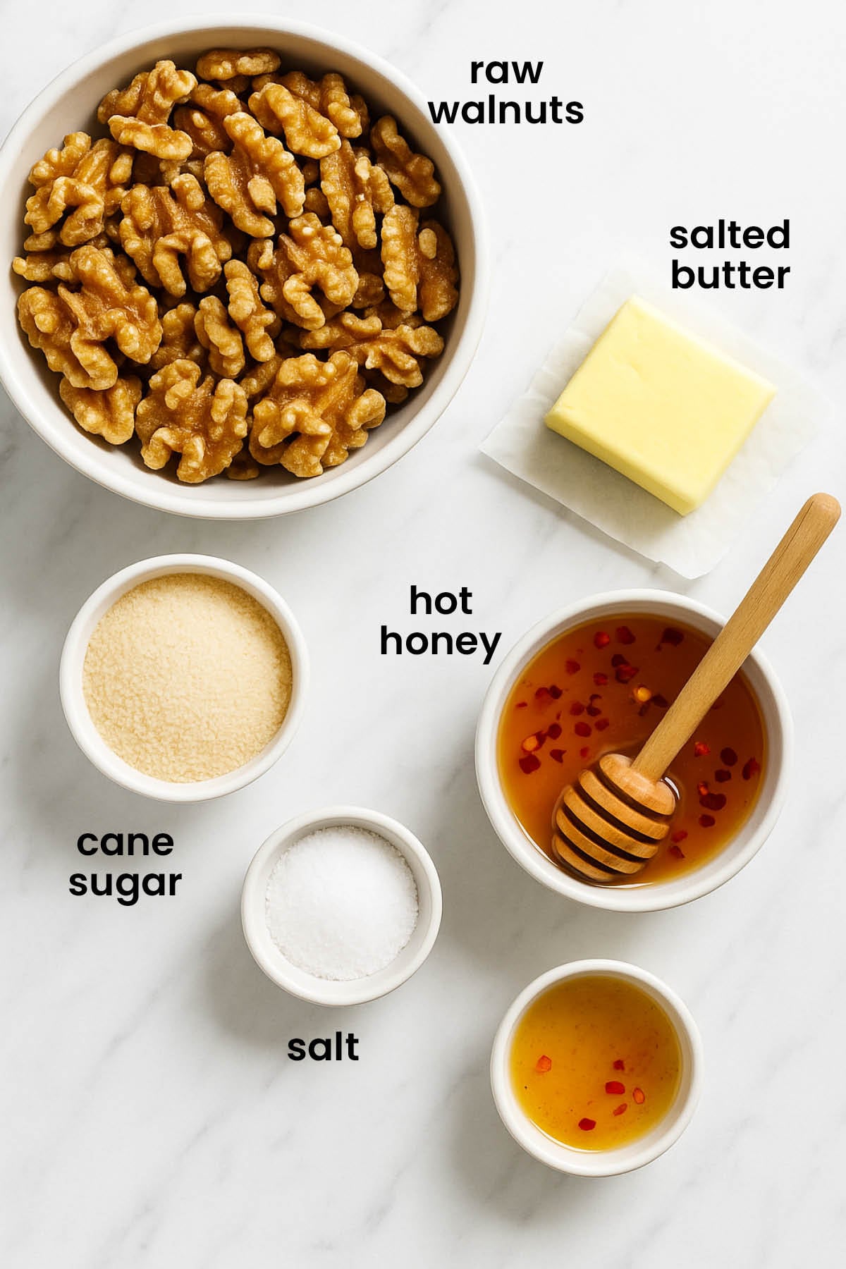 individual ingredients for hot honey roasted walnuts laid out against a white background.