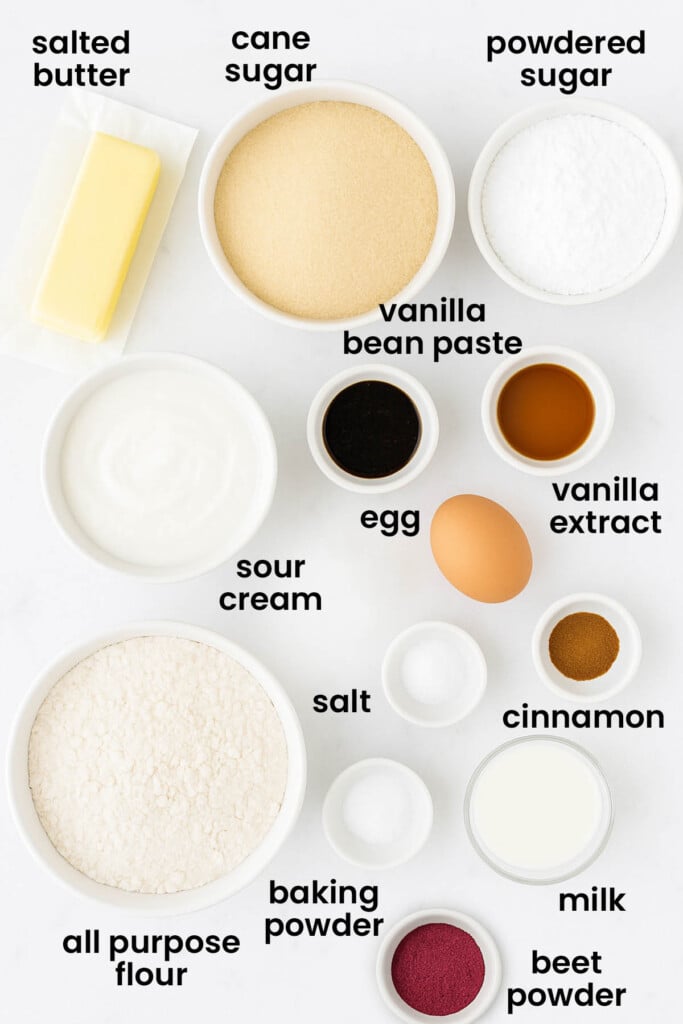 individual ingredients for organic sugar cookie bars with frosting laid out against a white background.