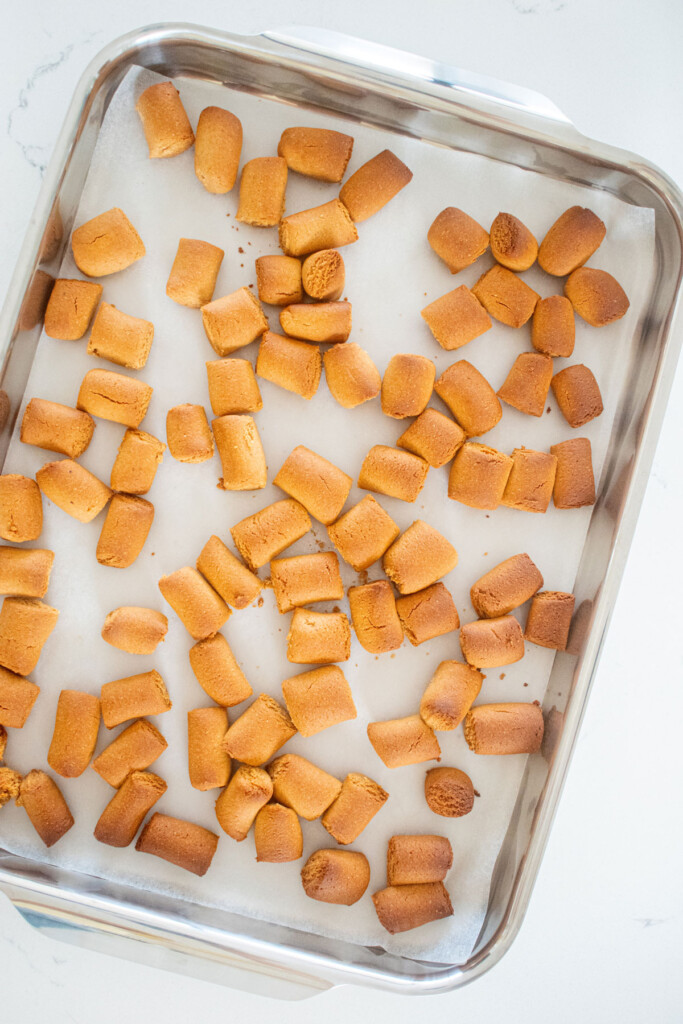mini peanut butter oat dog treats on a sheet pan.